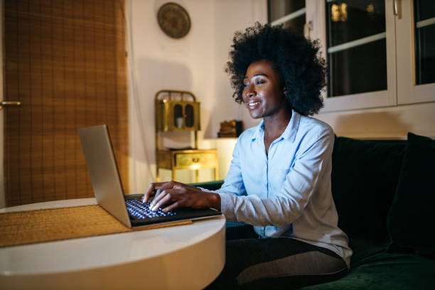 istock Young woman surfing the net at home 1253617373