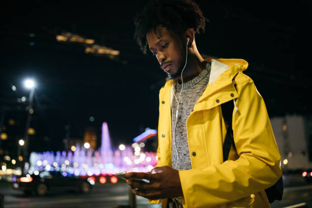 istock Young man enjoying a night walk 1253617474