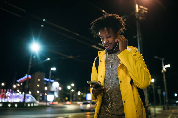 istock Young man enjoying a night walk 1253617539