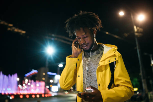 istock Young man enjoying a night walk 1253617540