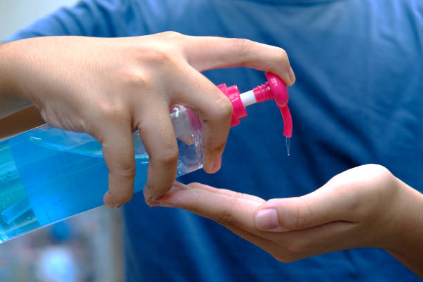 istock Boy washing hands with alcohol gel or antibacterial soap sanitizer after using a public restroom. Hygiene concept. prevent the spread of germs, bacteria and avoid infections corona virus. 1253620635