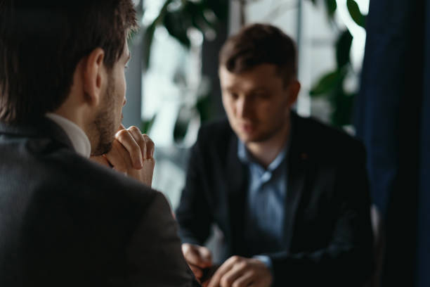 istock Two young businessmen discussing something 1253621960