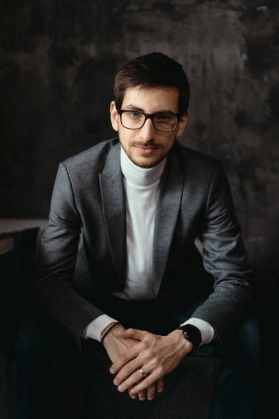 istock Portrait young, confident businessman wearing glasses 1253622005