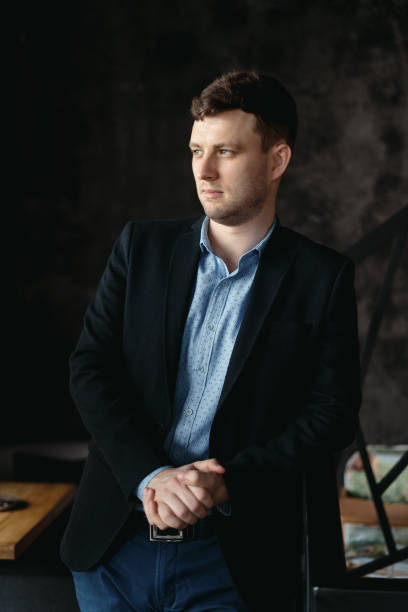 istock Man portrait posing in a loft modern space 1253622008