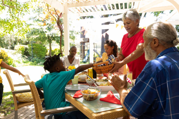 istock Family eating together at table 1253622730