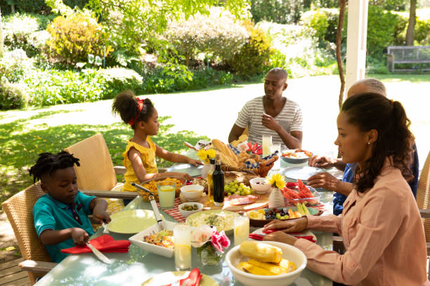 istock Family eating together at table 1253622745