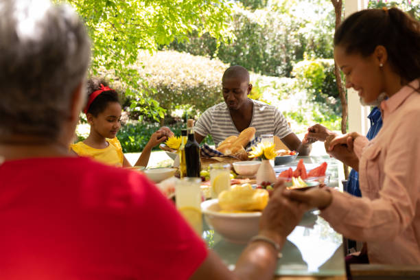 istock Family eating together at table 1253622795