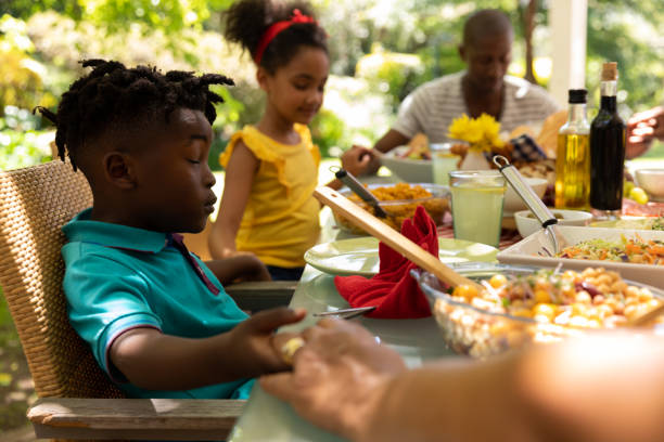 istock Family eating together at table 1253622806
