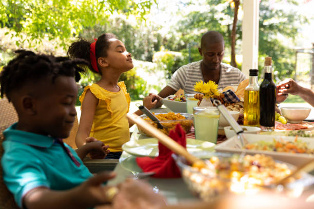 istock Family eating together at table 1253622813