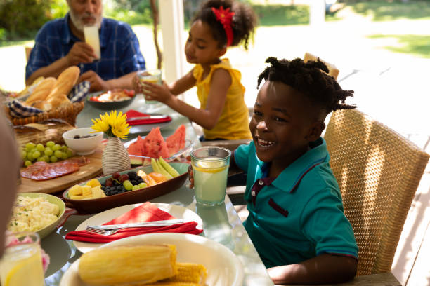 istock Family eating together at table 1253622905