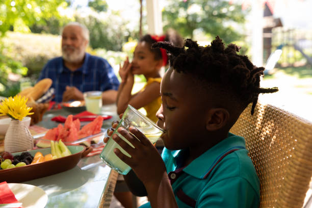 istock Family eating together at table 1253622919