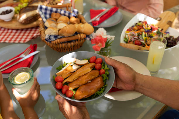 istock Family eating together at table 1253622974