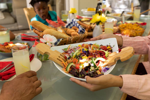 istock Family eating together at table 1253622986