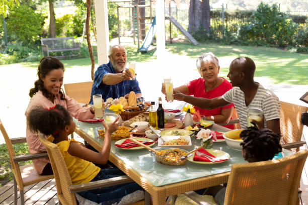 istock Family eating together at table 1253623076