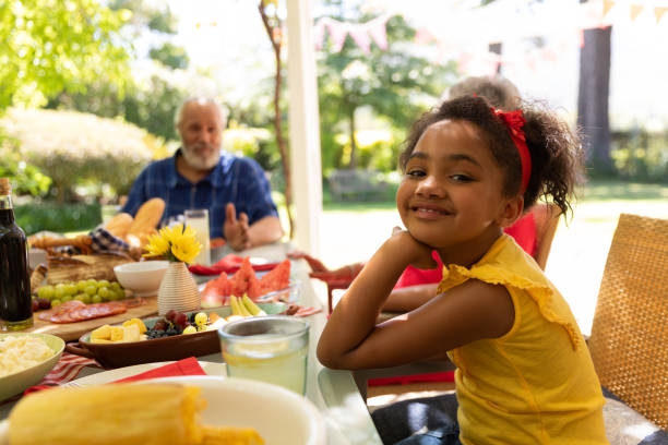 istock Little girl looking at camera and smiling 1253624538