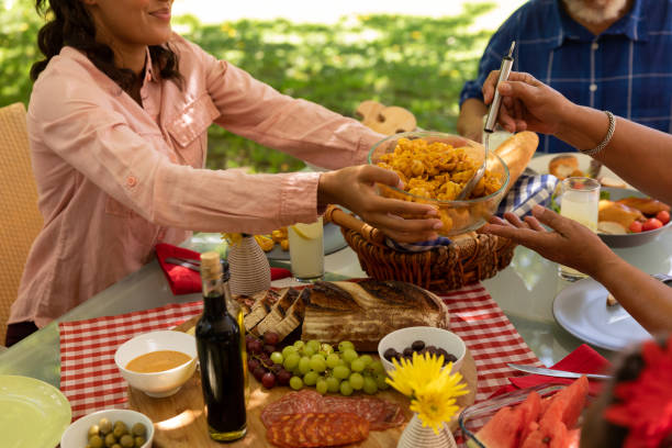 istock Family eating together at table 1253624596
