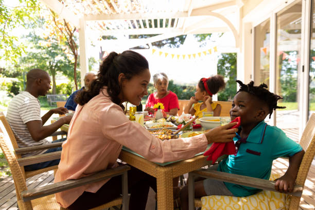 istock Family eating together at table 1253624620
