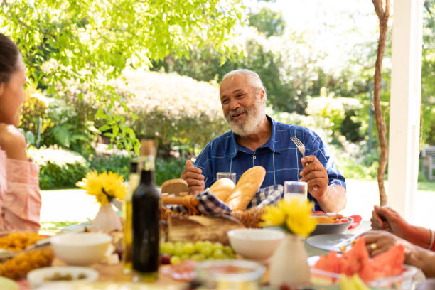 istock Family eating together at table 1253624668