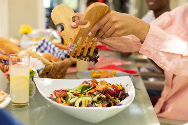 istock Family eating together at table 1253624673