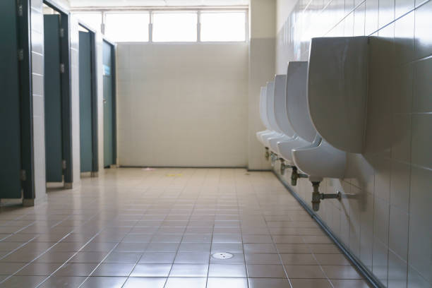 istock Row of clean urinal in men toilet 1253628085