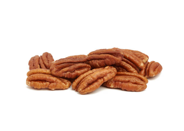 istock heap of peeled pecans isolated on a white background 1253631660