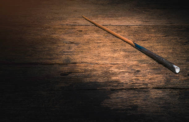 Magic wand on wooden table, Magic wand Wizard tool on vintage wooden background.