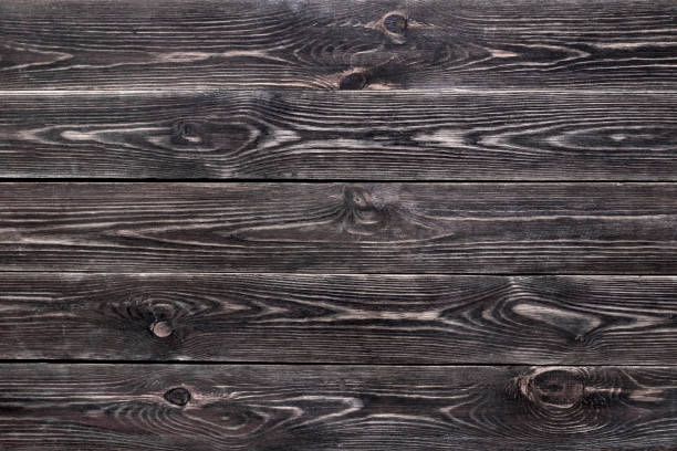 istock Background with unevenly applied paint, old and worn with a well-defined wood texture. 1253632437