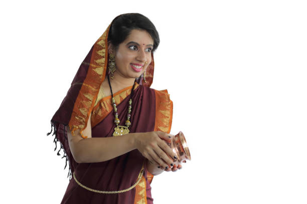 istock Indian Woman Holding Pooja Items 1253632494