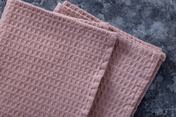 istock A stack of towels and napkins lying on the table. 1253633656