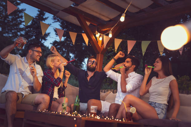 istock Friends having fun at poolside outdoor summertime party 1253635551