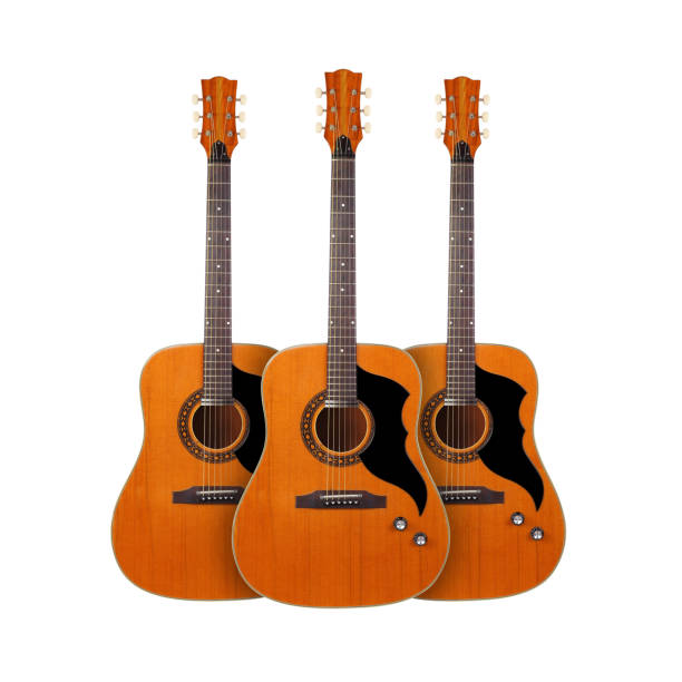 istock Musical instrument - Front view three classic vintage acoustic guitar. Isolated 1253639940