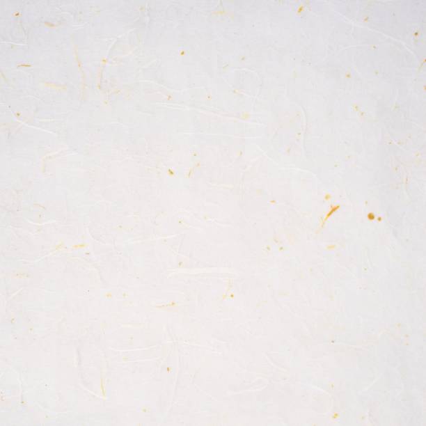istock White mulberry paper texture with yellow threads throughout 1253641433