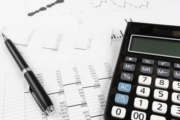 istock bookkeeping and accounting business concept, calculator and pen on data sheets 1253641669