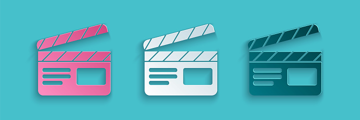 Paper cut Movie clapper icon isolated on blue background. Film clapper board. Clapperboard sign. Cinema production or media industry. Paper art style. Vector Illustration