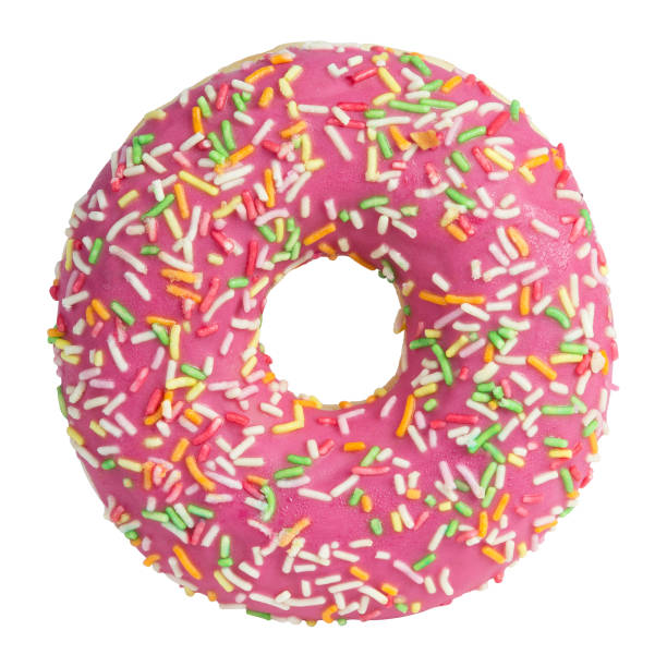 istock Pink donut with sprinkles isolated on white background 1253643991