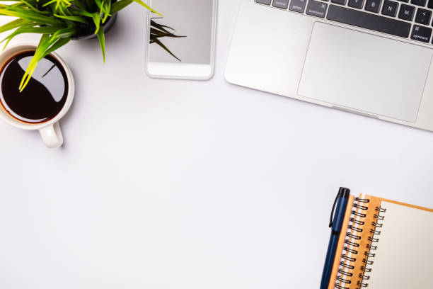 istock Flat lay of white office desk table 1253645852