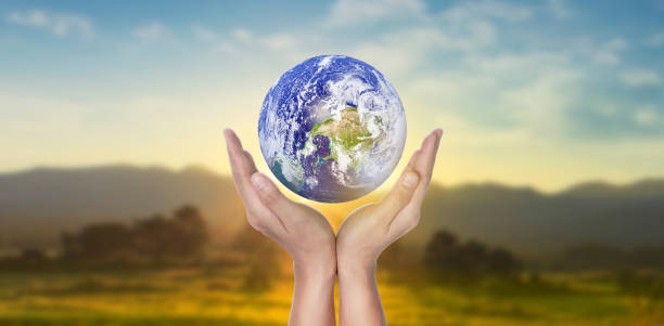 istock Globe, earth in human hand. Earth image provided by Nasa 1253649818