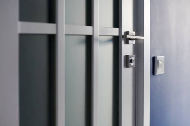 istock White interior door with handle. Blue wall in modern apartment 1253649927