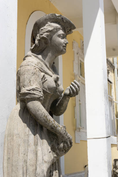 Cetinje, Montenegro - June 18, 2019: Old statue of woman in front of Djukanovic's Palace in Cetinje, Montenegro. One of the most popular attractions in the old capitol of Montenegro.