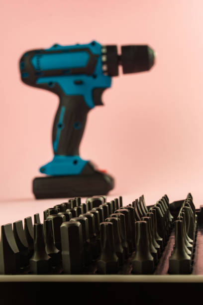 istock a screwdriver with a battery and a set of bits for it 1253655251