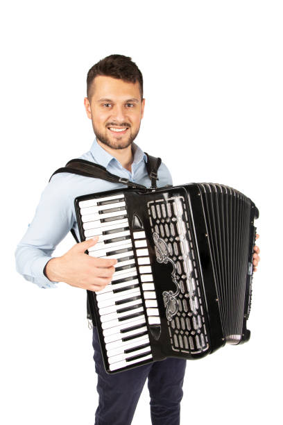 istock Young man playing accordion 1253656522