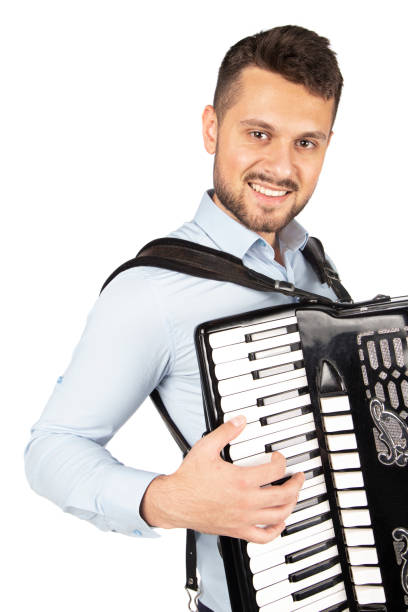 istock Young man playing accordion 1253656577