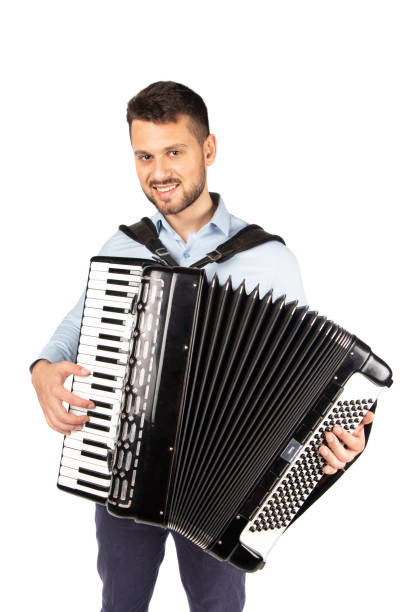 istock Young man playing accordion 1253656603