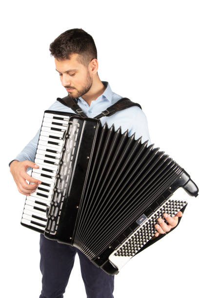 istock Young man playing accordion 1253656657