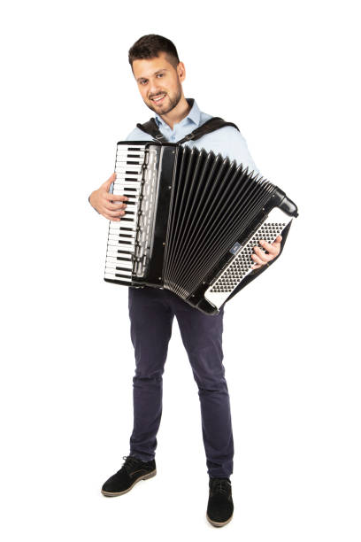 istock Young man playing accordion 1253656674