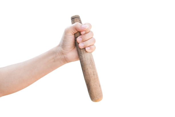 istock Kitchen pestle wood in hand isolated on white background with clipping path. 1253657518