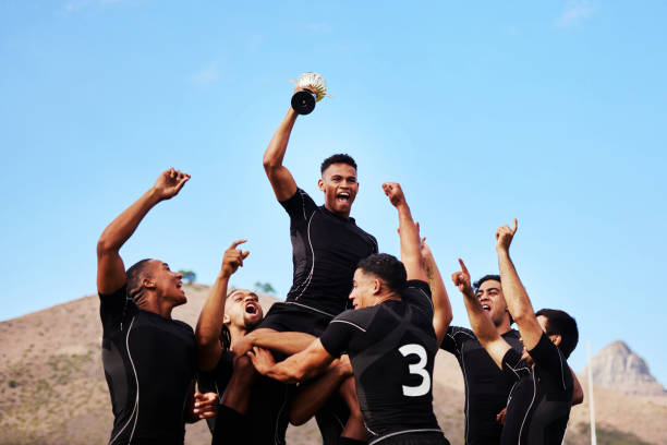 When you play your best you deserve the best Shot of a group of young rugby players celebrating after winning a game team sport stock pictures, royalty-free photos & images