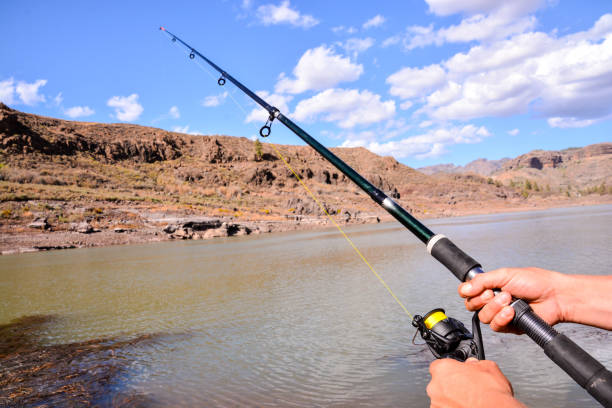 Fishing with rod on lake