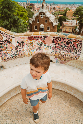 Boy visiting Parc Guell in Barcelona