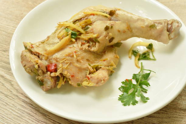 istock steamed spicy chicken thigh and leg with slice ginger 1253665559